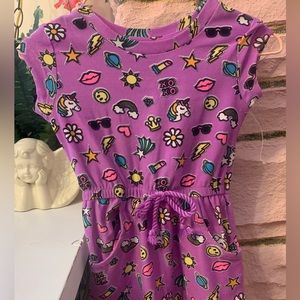Girls romper dress size 12 months. Purple with lots of fun graphics & pockets